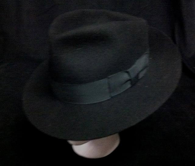 Michael Jackson Black Fedora: Michael Jackson Black Fedora - A Michael Jackson signature black fedora embossed with his name on the inside band (size Large). 100% Wool. This was presented to Michael's chef as a gift while in his e