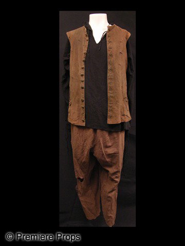 Cutthroat Island (1995) Pirate Costume: Cutthroat Island pirate costume, consisting of a brown vest ("M" written onto the collar), black shirt and brown pants. All items are distressed to appear aged and haggard. Certificate of authenticity