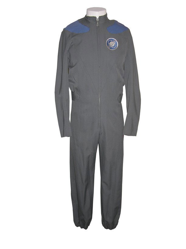 Sam Rockwell Galaxy Quest (1999) Costume: Sam Rockwell screen-worn jumpsuit for the character Guy Fleegman from Galaxy Quest. This one-piece gray jumpsuit with blue shoulder patches was used for the Fleegman character, who begins as a fan of 