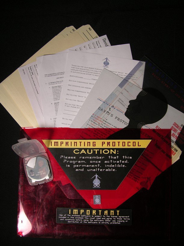Activation File for "David" in A.I. Artificial Int: File of papers and an activation disc for the character David, played by Haley Joel Osment, in Steven Spielberg's A.I. Artificial Intelligence (2001). This file, housed in a clear red plastic cover, c