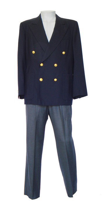 Robin Williams Screen Worn Peter Pan Costume: This navy double-breasted jacket with gold buttons and grey slacks were worn by Robin Williams, playing the part of Peter Banning – the adult Peter Pan, in the 1991 film HOOK. Steven Spielberg's seq
