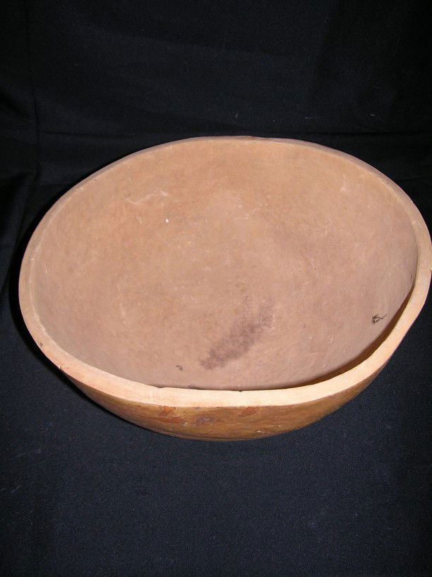 The Flintstones (1994) Salad Bowl: Large salad bowl from Fred Flintstone's (John Goodman) dinner table in The Flintstones (1994). This bowl is constructed of lightweight wood, painted and distressed in order to present a prehistoric lo