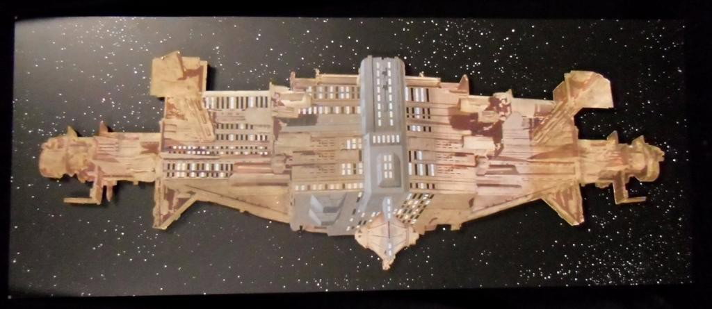 Aliens (1986) Spaceship Artwork: Aliens (1986) - A production made giant matte painting of the Gateway spaceship used for early tests by James Cameron. Hand painted and created on a very large and heavy wooden board is the star backg