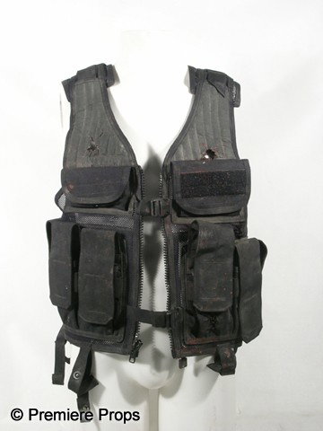 Resident Evil Afterlife Bloody Vest Movie Props: Resident Evil Afterlife (2010) - Bloody, dirty, and sticky, black with zipper front, multiple pockets in the front and sides, mesh with thick foam front at the shoulders, 'Blackhawk' embroidered on th