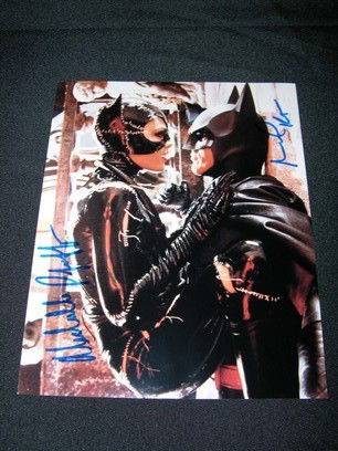 Batman Returns Signed Photo: 8 x 10 color photo of Michael Keaton as Batman and Michelle Pfeiffer as Catwoman, signed by both actors in blue marker. Includes a certificate of authenticity from Home Run Sports Cards.
