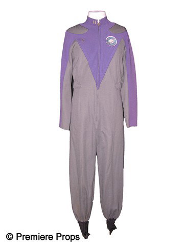 Alan Rickman Screen Worn Galaxy Quest Uniform: Screen worn gray and purple uniform, worn by Alan Rickman as Dr. Lazarus in Galaxy Quest (1999). The film detailed the adventures of a group of actors from a television series called Galaxy Quest who
