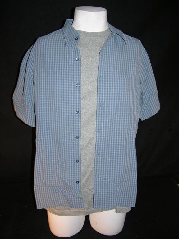 Eddie Murphy Screen Worn Costume from Norbit: Nordstrom Pure Stuff short sleeve button down blue shirt, worn by Eddie Murphy as Norbit in the eponymous film. Complete with a certificate of authenticity.