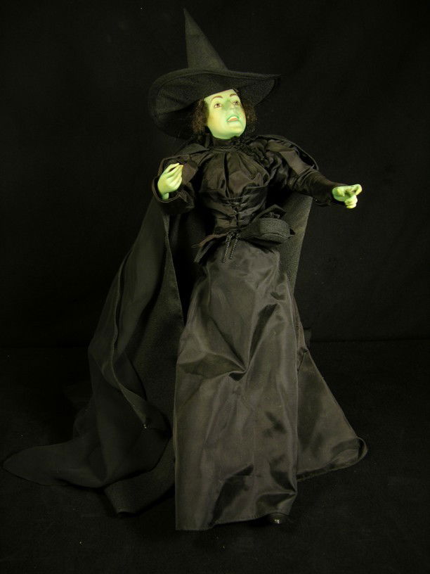 Wicked Witch of the West Franklin Mint Statue: Special figure from the Franklin Mint depicting Margaret Hamilton as the Wicked Witch of the West, dressed in a black cloth clostume with removable hat and black sheer pieces originating from the hat
