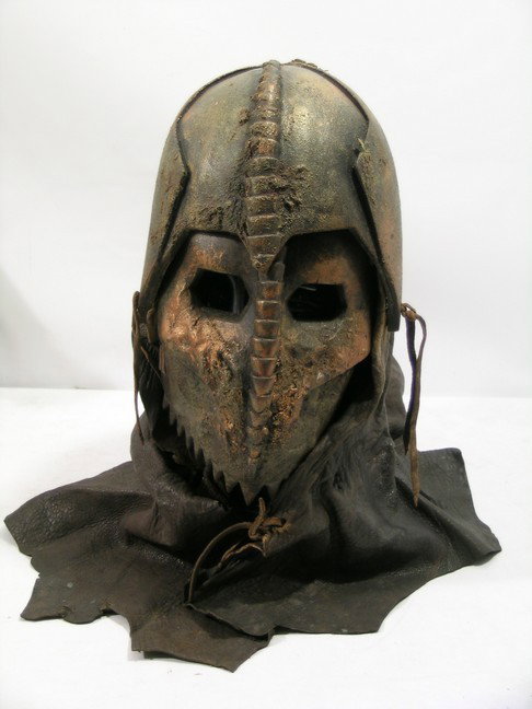 Immortals Heraklion Soldier Helmet: Immortals (2011) - Heraklion Soldier screen worn, copper and brown rubber custom made for the film mask and helmet with leather hanging over the shoulders and neck. Note: This item located in Los Ange
