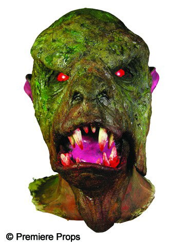 Screen Worn Buffy, The Vampire Slayer Makeup Mount: Makeup for a demon appearing in the television series Buffy, the Vampire Slayer, mounted to a bust for display. Features two rows of fanged teeth, red eyes and pointed ears. Rendered in tones of green