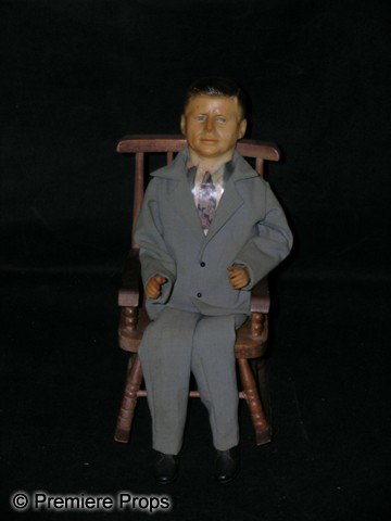John F. Kennedy Model Doll: Small model of John F. Kennedy in a rocking chair. (approx. 11" tall)