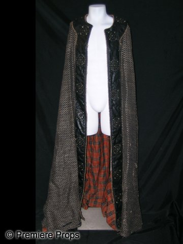 Camelot King Arthur (Jamie Campbell) Hero Cape: Screen used Hero black wool and brown leather cape worn by King Arthur (Jamie Campbell Bower). Full length cape with embroidered Leather stitched pattern along the inside length of cape. A plaid 'unde