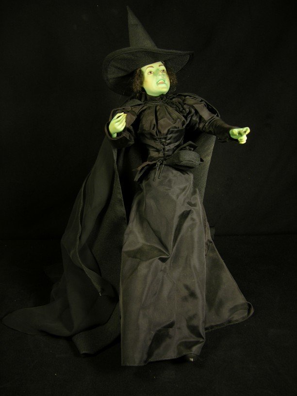 Wicked Witch of the West Franklin Mint Statue: Special figure from the Franklin Mint depicting Margaret Hamilton as the Wicked Witch of the West, dressed in a black cloth clostume with removable hat and black sheer pieces originating from the hat