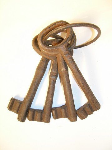 Pirates of the Caribbean Jailers Keys: This is a set of (4) prop Jailer's skeleton keys used during the production of the 'Pirates of the Caribbean' films. The keys are made of heavy cast iron, come on a big key ring and are extremely rust