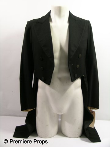 Vintage Tuxedo Jacket with Tails: Black tuxedo jacket sourced from Warner Bros. and used in a 1930s film production. Includes a United Costumers label with the name Carl Frederick handwritten on it.