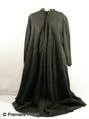 Vintage Priest Cassock from Warner Bros.: Black cassock costume for a priest, sourced from Warner Bros. wardrobe department and used in a Golden Age Hollywood production. Some wear to the back, possibly intentionally so for a film sequence.
