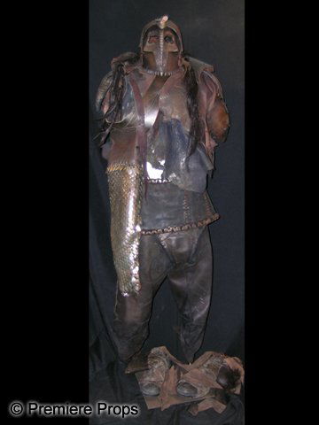 Immortals Mondragon (Matthew G. Taylor) Costume: This is a complete, screen worn hero Mondragon (Matthew G. Taylor) costume from 2011's 'Immortals.' The wardrobe consists of a heavy leather chest/top portion; a long sleeve, 'fish scale' patterned le