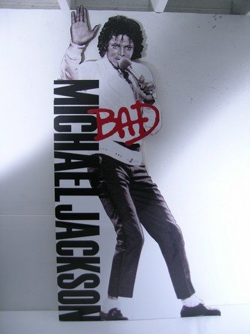 Take Me Home Michael Jackson Standee: This is a promotional standee from the 2011 comedy-romance film 'Take Me Home Tonight.' The standee is secured on foam board and features the 1987 Michael Jackson 'Bad' album cover (measures approx. 7