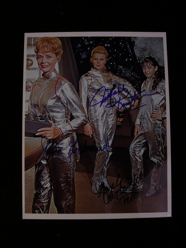 Lost in Space Signed Photo: This is an autographed, glossy color photo of the three female characters from the 1960's Irwin Allen sci-fi television series 'Lost In Space' (1965-1968). The series tells the story of the space-fari