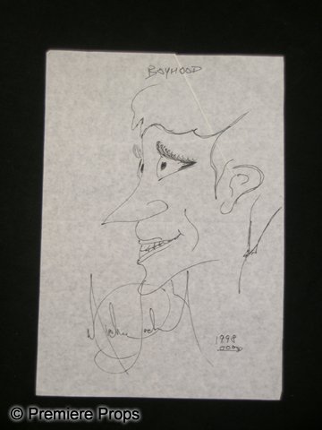 Michael Jackson Signed Drawing: From the legendary King of Pop. This is a sketch made by Michael Jackson himself in 1998. The drawing features the smiling face of a boy with 'Boyhood' written above his head, and is signed by MJ in t