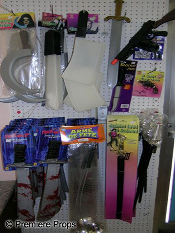 Lot of Retail Toy Weapons: Lot of assorted retail toy weapons: 6 sickles, 6 glow in the dark machetes, 6 glow in the dark cleavers, 27 Friday the 13 machetes, 5 musketeer swords, 5 swords, 1 bloody knife, 2 handguns, 8 guns, 1