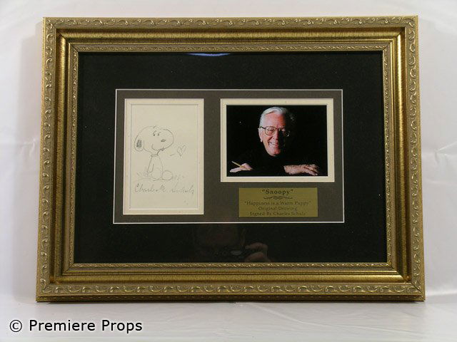 Snoopy Original Drawing Charles Schulz Signed: Original Snoopy drawing autographed by Charles Schulz with a photo of Charles Schulz (approx. 19"x14"). Oversized item. Additional postage required.
