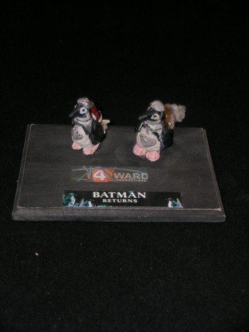 'Batman Returns' Screen Used Miniature Penguins: This is a pair of miniature penguins used during the filming of Tim Burton's 1992 Batman installment 'Batman Returns,' starring Michael Keaton and Danny DeVito. The penguins are crafted with tiny miss