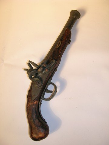 'Pirates of the Caribbean' Background Prop Pirate's: Used by background actors during filming of 'Pirates of the Caribbean,' this is a very detailed Pirate's Pistol. The musket-style pistol is made from aged wood and steel and the trigger and firing mec