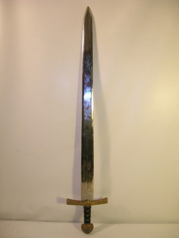 'Lord Of The Rings: Return Of The King' Sword: From the blockbuster trilogy installment 'Lord of the Rings: The Return of the King' (2003), this is a beautifully detailed, all metal sword. The sword was one of many in a pile of swords that lay on 