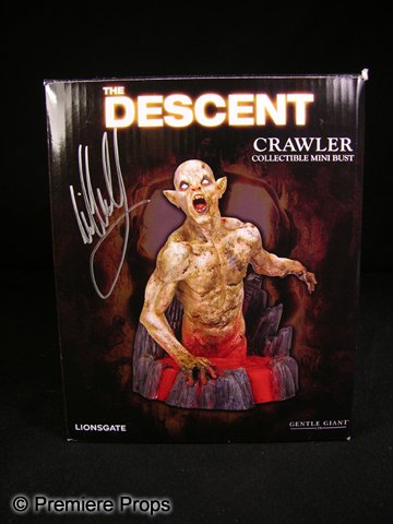Neil Marshall Signed Descent Bust: The Descent Crawler mini bust signed by film director Neil Marshall on the box and the figure itself. (8x7x7)