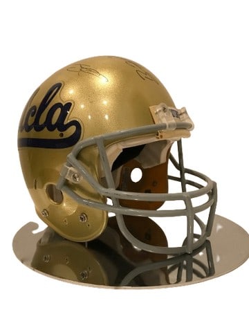 UCLA Football Coach Spanos & Players Signed Helmet: UCLA Bruins "Schutt" brand football helmet signed by Coach Spanos and eight players. Some of the signatures include #1 Rusher, #23, #8 and a few more. Lou Spanos was the UCLA defensive coordinator. He