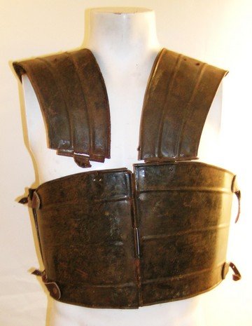Ben Hur (1959) Roman Soldier Chest Armor: This is a full-size metal chest and back 'battle' armor piece from the 1959 epic adventure 'Ben Hur.' The prop is made from hand-forged tin or sheet metal with large bent metal 'shoulder harnesses' ri