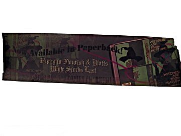 Harry Potter Chamber of Secrets Banner Prop: Harry Potter (Daniel Radcliffe) is whisked off by supernatural double-decker bus driven by a shrunken head in "Harry Potter and the Chamber of Secrets" (2002). On the bus are a series of advertisement