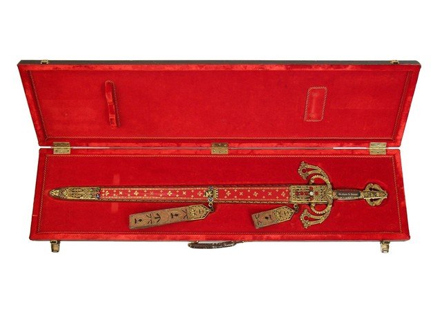 El Cid Custom Sword: For years, the idea of a movie producer has always been that of the cigar smoking larger-than-life character with a massive desk, and the spirit of a gambler. He would put his own money, or those he c