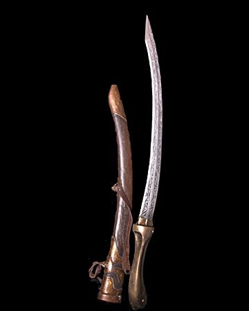 Immortals Sword & Sheath Prop: Screen used, hero, silver and bronze with etched design on the blade curved sword with some wear, and brown rubber like leather with brown leather clips sheath. (approx. 36" long) This is similar to t