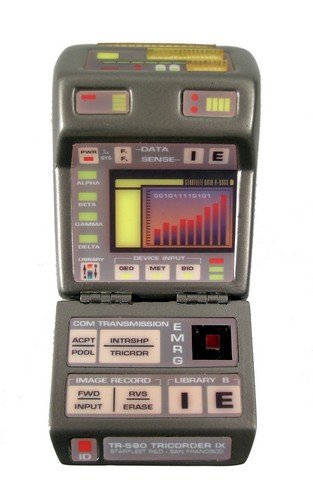 Star Trek: Deep Space Nine Static Tricorder: Static Starfleet TR-590 Mark IX Tricorder of cast-resin painted silver, hinged at lower edge to swing open revealing multiple full-color graphics inside that resemble the lighting functions of a "hero