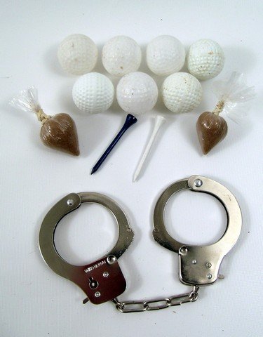 Lost Screen Used Props: For "Lost" (2004-2010) fans a treasure chest of screen used collectables. Included are a set of plastic golf balls, tees, and two fake heroin drug bags used by Charlie Pace (Dominic Monaghan) and John