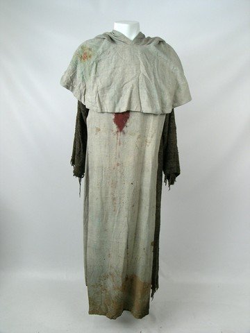 Highlander Endgame Jacob Kell (Bruce Payne) Costume: From 'Highlander: Endgame" (2000), this is a hero screen worn hooded tunic with stab wound (through entire costume) and blood stains worn by Jacob Kell (Bruce Payne). Tunic is heather grey on the outs