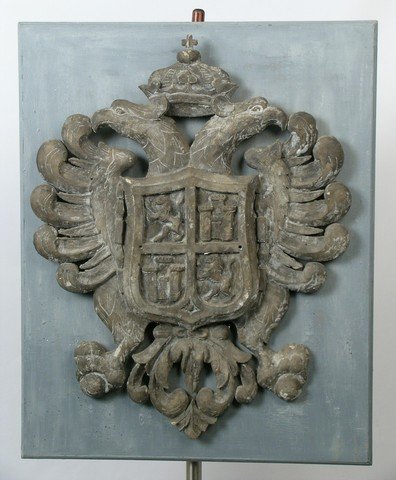 Larry Hagman Sculpture Of Family Crest: From the Larry Hagman Estate, a large stone-plaster sculpture of a his family crest mounted on a plywood backing. Approx 25"x31". Because of the size and weight of this item, there will be an addition