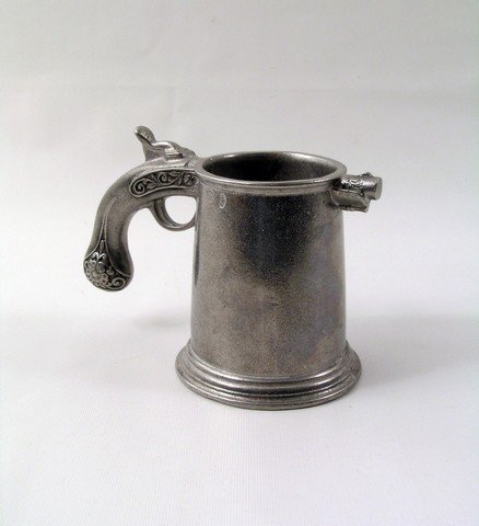 Kill Bill Vol 1 Gun Mug Prop: A truly one-of-a-kind prop from a truly one-of-a-kind movie, Kill Bill: Vol 1 (2003), a metal mug with a "gun" handle. Must be seen to be believed! Used as a background prop. (Approx. 5" tall).