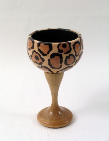 Austin Powers Goldmember Wood Cheetah Print Cup Prop: "Cheetah" print becomes all the rage in "Austin Powers: Goldmember" (2002). This is a wood cheetah print back prop cup from the smash-hit sequel. (approx. 6 1/2" tall).