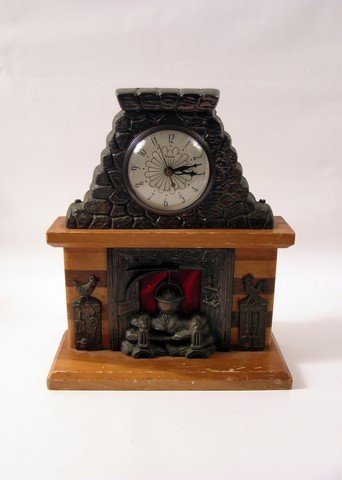 Harry And The Hendersons Mantel Clock Prop: Only Steven Spielberg's could make a comedy about a family that befriends "Big Foot". That was the case in "Harry and the Hendersons" (1987). This is a mantel clock with fireplace design used as a bac
