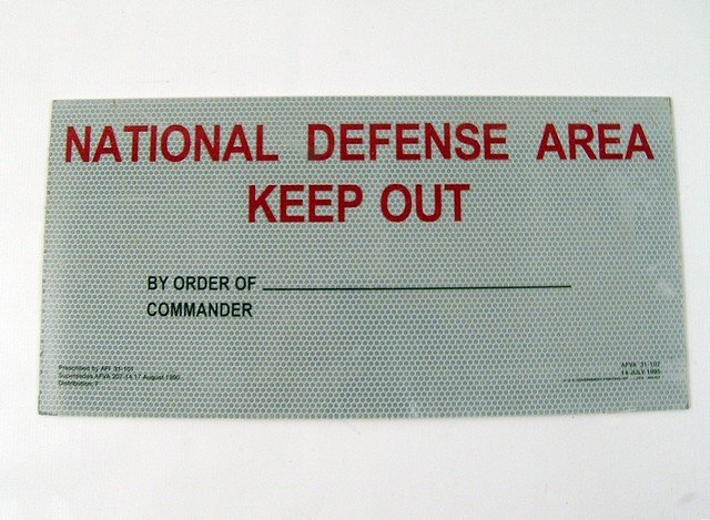 X-Files Defense Sign Prop: A "National Defense" sign used in the classic TV series "The X-Files" (1993). (Apron. 17 1/2" x 8 1/2").