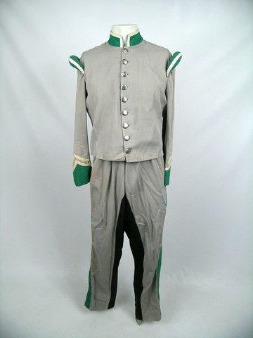 The Alamo (1960) Mexican Army Lancer Costume: A screen used hero Mexican Army Lancer outfit from General Santa Anna's invading Army in John Wayne's classic "The Alamo" (1960), It includes a gray tunic with green stand-up collar and gray pants. Al