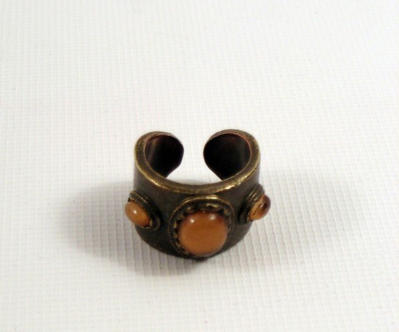 Harry Potter and the Sorcerer's Stone Diagon Alley: Harry Potter and the Sorcerer's Stone Diagon Alley Metal Ring Prop - A background Diagon Alley metal and orange rock ring from "Harry Potter and the Sorcerer's Stone" (2001).