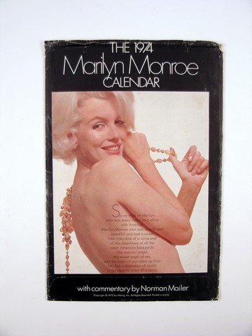 Marilyn Monroe Famous Photographers 1974 Calendar: This is one of the original Marilyn Monroe "Famous Photographer" 1974 Calendars with the original sleeve. The calendar inside features a cornucopia of iconic Monroe photos including Tom Kelley's "A Ne