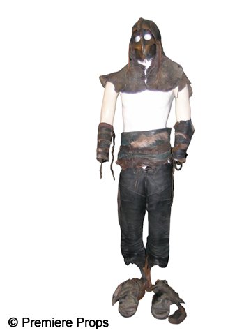 Immortals Heraklion Soldier Costume: Heraklion Soldier screen worn, helmet with leather design, leather belt, leather pants, and leather and fur sandals (wrist cuffs not included).