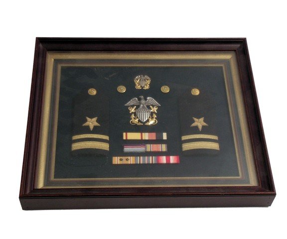 Independence Day US Navy Display Case Prop: Independence Day US Navy Display Case Prop - From Roland Emmerich's roaring battle cry of American might and glory under attack (and five years before 9/11), "Independence Day" (1996) comes this backg