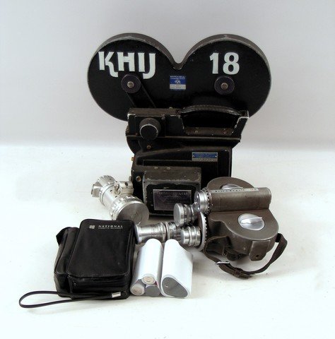 Big Eyes Vintage Camcorder Movie Props: Screen used, 'Bell & Howell' Eye Witness News CBS vintage camcorder, 'Frezzi - Cordless' 16mm TV News Film Camera reel, 'Berthiot' camera lens, 'National' cassette recorder, and two battery packs.