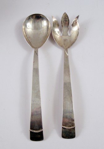 Bewitched Serving Utensils Movie Props: From the beloved Bewitched TV show comes two metal serving utensils used in the production of the show. Measures approximately 13" long.